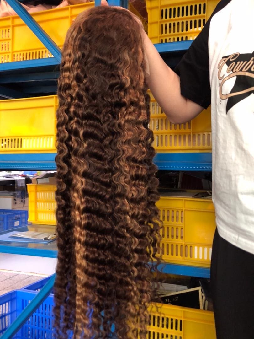 A person holding long hair in their hands.