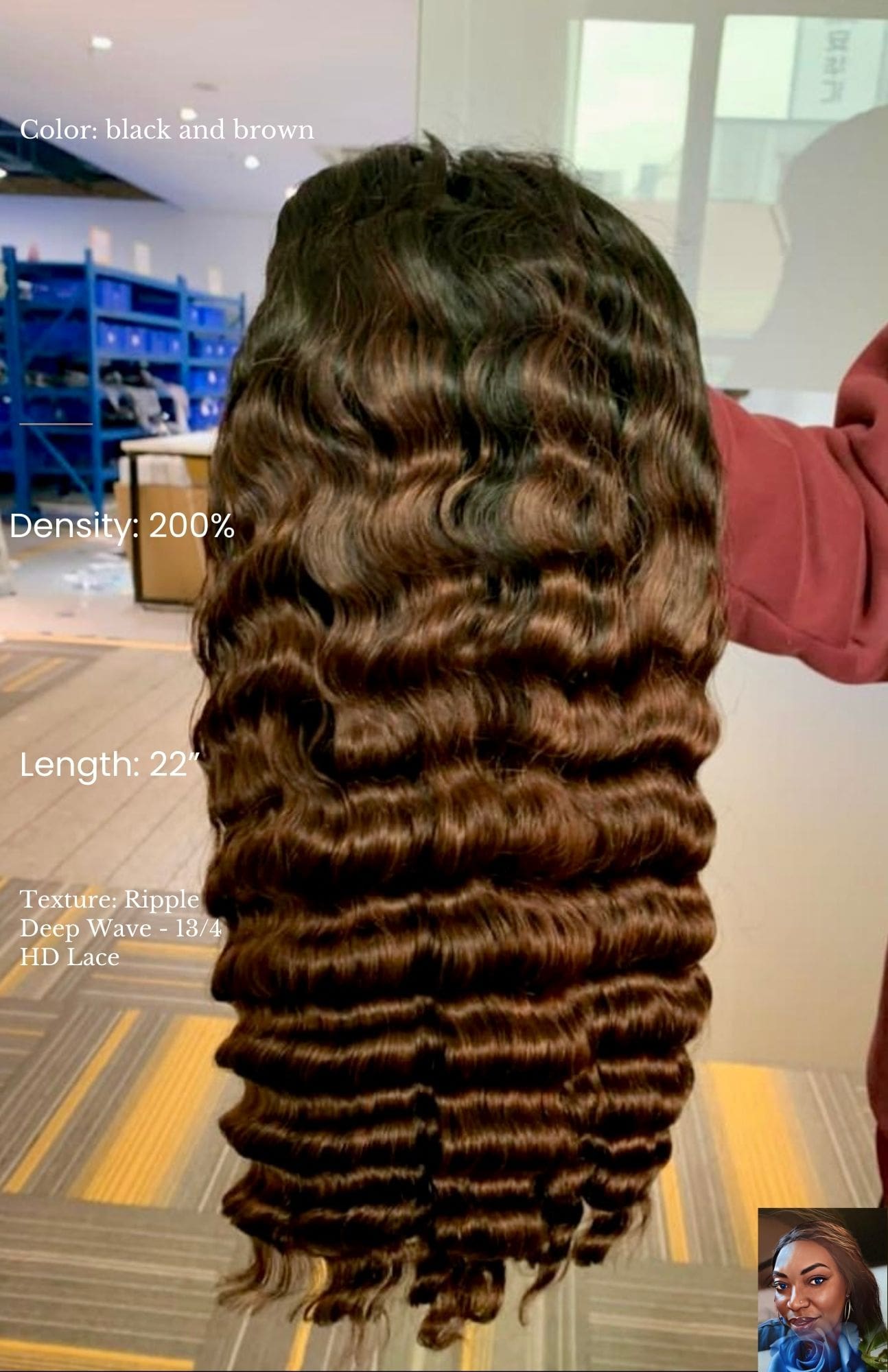 A woman with long hair is standing in front of boxes.