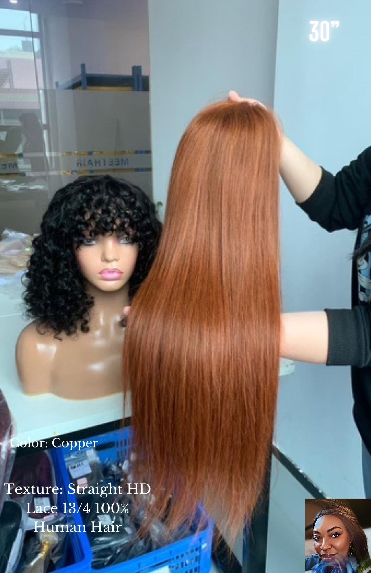 A woman is combing her hair next to a wig.